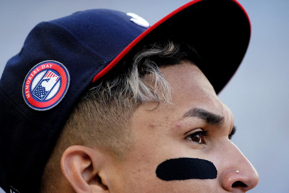 Atlanta Braves' Johan Camargo wears a logo to observe Memorial Day on his cap during a baseball game against the Washington Nationals, Monday, May 31, 2021, in Atlanta. (AP Photo/John Bazemore)