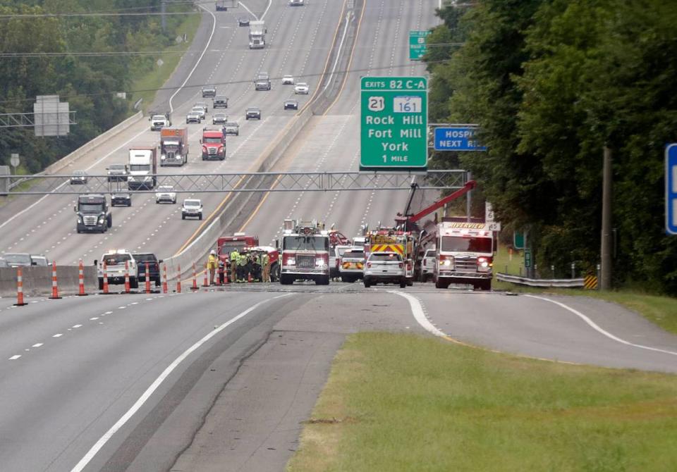 Emergency crews work to clear a multi-vehicle crash near the Sutton Road exit on I-77 in Fort Mill Friday morning.