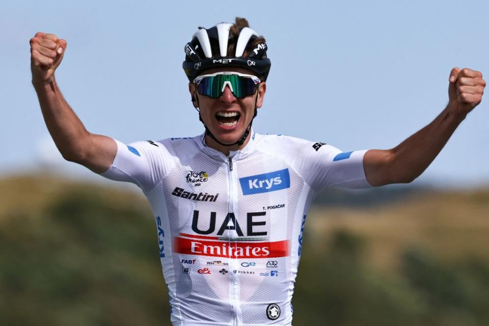 UAE Team Emirates Slovenian rider Tadej Pogacar wearing the best young riders white jersey cycles to the finish line to win the 20th stage of the 110th edition of the Tour de France cycling race 133 km between Belfort and Le Markstein Fellering in Eastern France on July 22 2023 Photo by AnneChristine POUJOULAT  AFP Photo by ANNECHRISTINE POUJOULATAFP via Getty Images