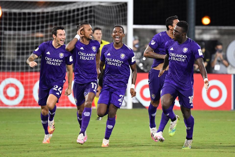 Orlando City SC's Nani (17) celebrates with teammates after scoring the game-winning penalty kick to defeat the Los Angeles FC in the MLS is Back Tournament quarterfinals at ESPN Wide World of Sports Complex.