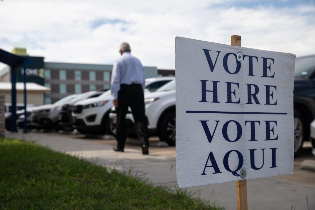 A man walks up to a line of voters outside of the Deaf and Hard of Hearing Center on Election Day, Tuesday, Nov. 7, 2023, in Corpus Christi, Texas.