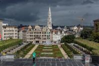 A tourist takes a photograph in front Grand Place of Brussels amid the coronavirus disease (COVID-19) outbreak in Brussels