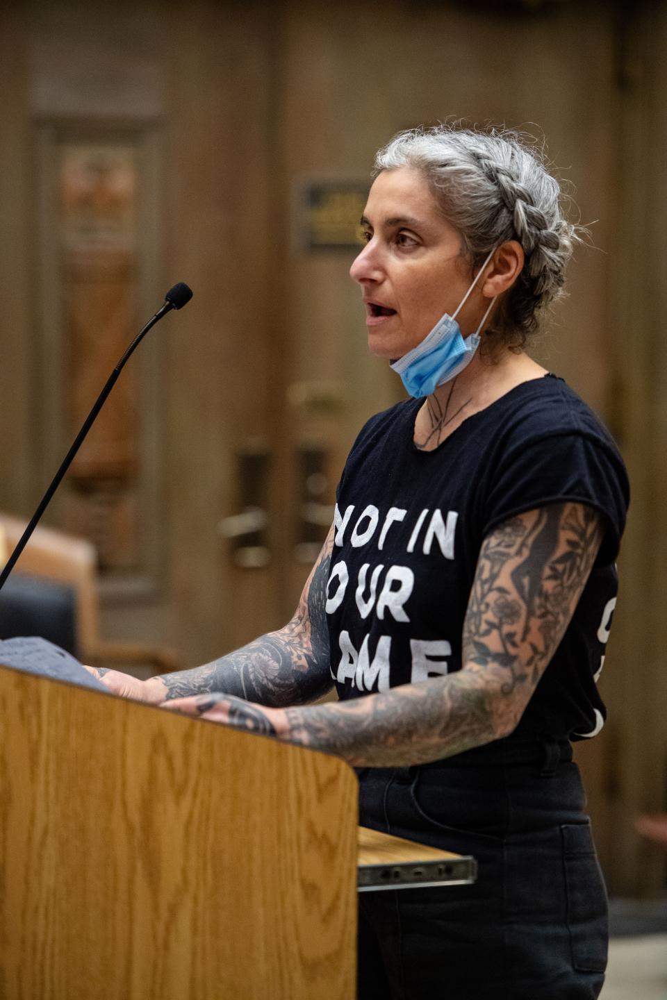 Melissa Weiss wears a shirt with the words “not in our name” and “Jews say cease fire now,” while speaking to the Asheville City Council during public comment, March 12, 2024.