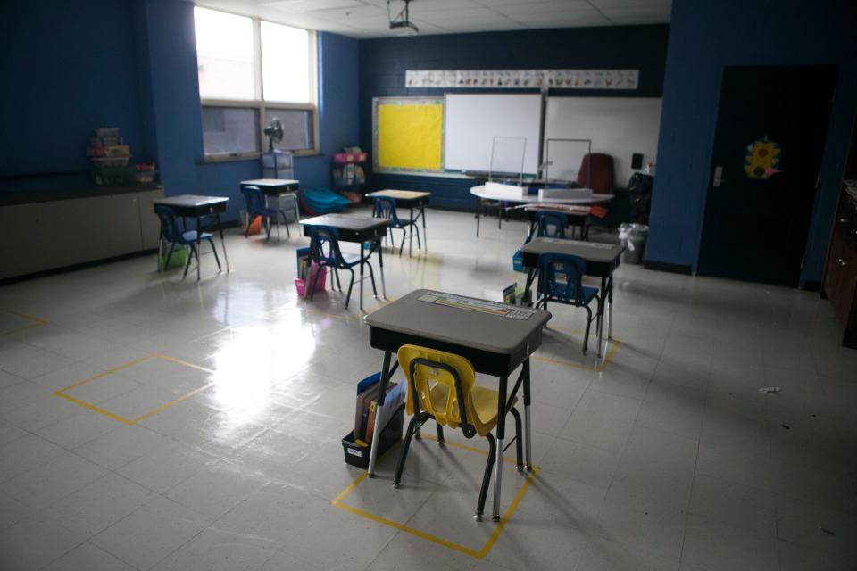 Back in 2020, desks were socially distanced apart at A plexiglass barrier sits on a desk at this Lake Forest East Elementary School.