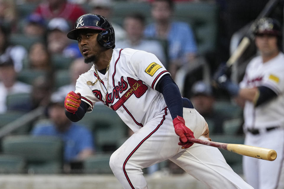 Atlanta Braves' Ozzie Albies watches his three-run double against the Colorado Rockies during the second inning of a baseball game Thursday, June 15, 2023, in Atlanta. (AP Photo/John Bazemore)