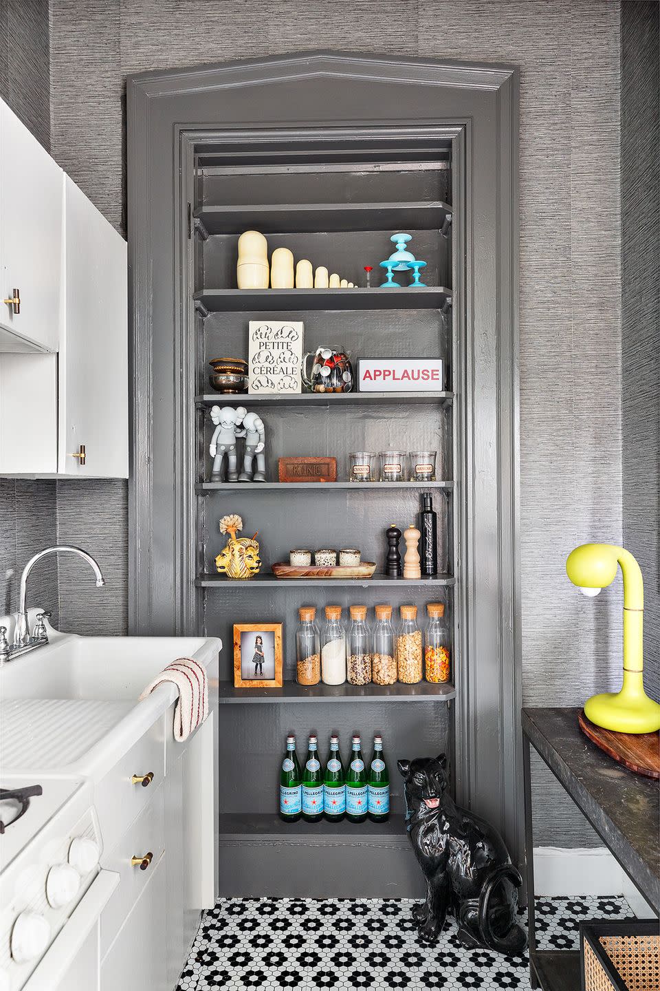 a cabinet with bottles and other objects