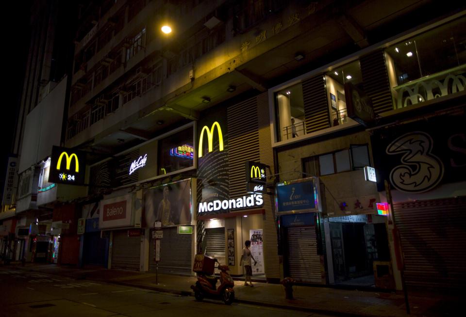 A man walks past at a 24-hour McDonald's restaurant in Hong Kong, China November 10, 2015. A large number of homeless people sleeping on the street has long been been a problem in Hong Kong mainly due to its high rent and soaring property. In recent years, McDonald's 24-hour fast food shops opening all over the city have become popular alternatives for people, know as McRefugees or McSleepers, to spend the night in a safer and more comfortable way than on the street. McDonaldâ€™s Hong Kong said in a statement that it is accommodating to people staying long in the restaurant for their own respective reasons, while striking a good balance to ensure that customers enjoy their dining experience. Picture taken on November 10, 2015. REUTERS/Tyrone Siu