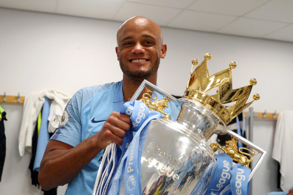 BRIGHTON, ENGLAND - MAY 12: Vincent Kompany of Manchester City celebrates with the Premier League Trophy after winning the title following the Premier League match between Brighton & Hove Albion and Manchester City at American Express Community Stadium on May 12, 2019 in Brighton, United Kingdom. (Photo by Victoria Haydn/Manchester City FC via Getty Images)