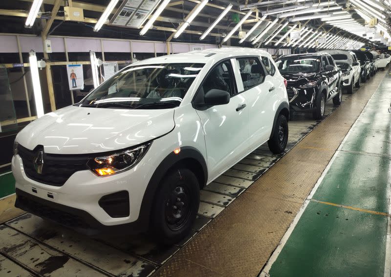 Employees work at the manufacturing plant of Renault Nissan Automotive India in Oragadam