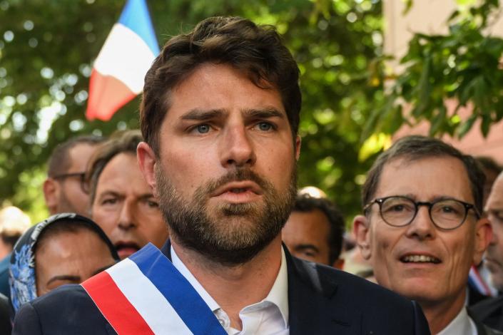 The Mayor of L'Hay-les-Roses Vincent Jeanbrun takes part in a nationwide action after rioters rammed a vehicle into the his house injuring his wife and one of his children overnight (AFP via Getty Images)