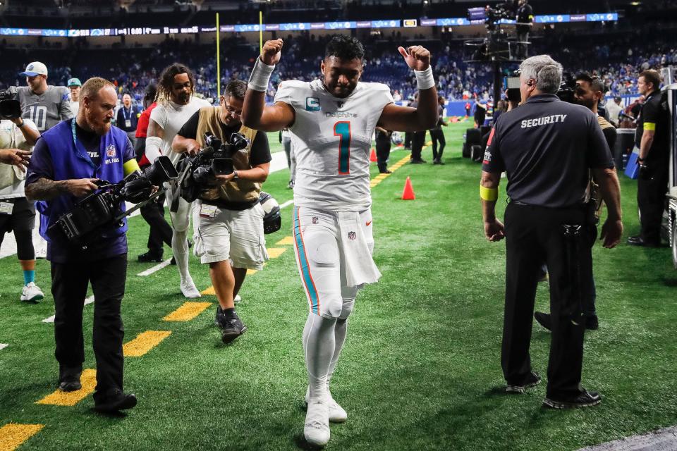 Miami Dolphins quarterback Tua Tagovailoa (1) waves at fans after the Dolphins defeated Detroit Lions, 31-27, at Ford Field in Detroit on Sunday, Oct. 30, 2022.