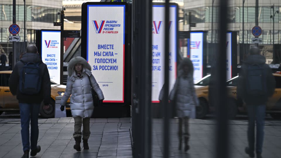 "Together we are strong, we vote for Russia!" reads a billboard in Moscow's business district, March 12, 2024. - Dmitry Serebryakov/AP