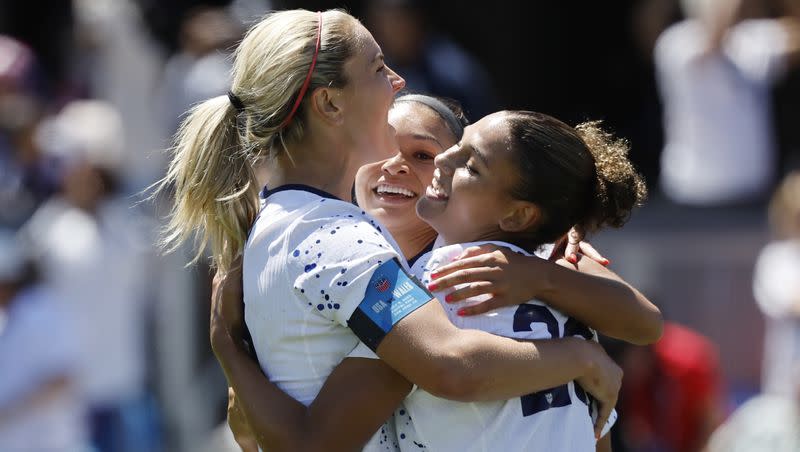 United States midfielder Lindsey Horan, left, and Sophia Smith, center, celebrate with forward Trinity Rodman, right, who scored in the second half of a FIFA Women’s World Cup send-off soccer match against Wales in San Jose, Calif., Sunday, July 9, 2023. (AP Photo/Josie Lepe)