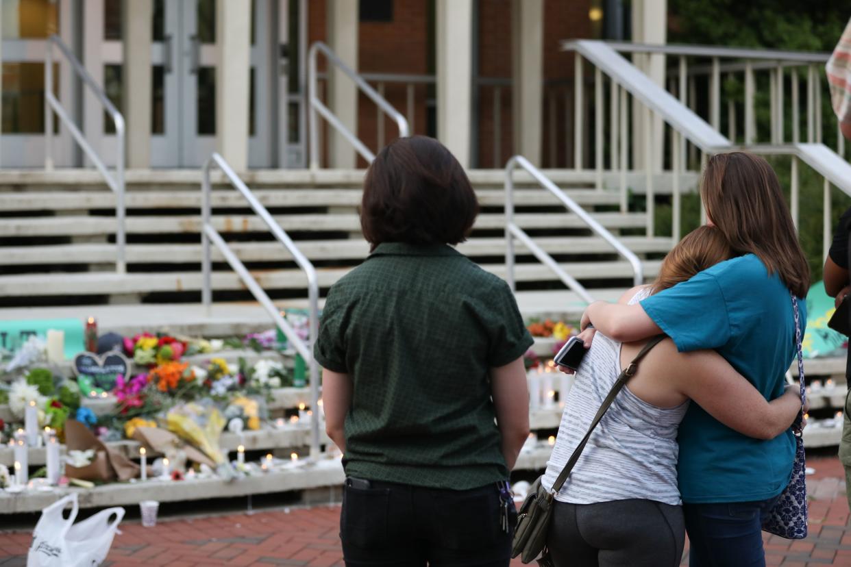 Students pay their respects to victims of the April 30th, 2019 mass shooting at University of North Carolina Charlotte. (Photo: Getty Images)