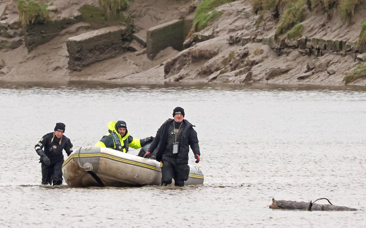 Police divers continue to search the River Wyre, in Lancashire - Julian Hamilton/Daily Mirror