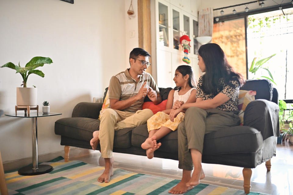 Parents should be on the same page when it comes to talking to their kids about cancer. (Image via Getty Images)