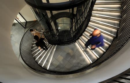 People walk down stairs at the newly-opened Japan House in the Kensington district of London, Britain June 21, 2018. REUTERS/Simon Dawson