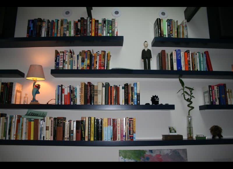 Floating shelves are a really cool way to display books, DVDs or cute decor because they appear to be magically suspended. And they aren't as hard as you'd think to install. First, decide what length you'd like the shelves to be and purchase pine boards in that size. Then, paint or stain them whatever color you'd like. You will need <a href="http://easttennesseeonlinegeneralstore.ecrater.com/p/12401314/toggler-snaptoggle-ba-heavy-duty-3-16" target="_hplink">toggle bolts</a>, and <a href="http://www.amazon.com/b?ie=UTF8&node=517826" target="_hplink">braces</a> to hold the shelves, which are available at your local home improvement store. Toggle bolts will allow you to securely hang the shelves from any spot, even if there are no studs to drill into. Mark where you'd like to put the shelves, then drill the toggle bolts into the wall. Then screw the braces into the toggle bolts. Finally, place the shelves on the braces and you're all set!    For a full tutorial head to <a href="http://www.homestoriesatoz.com/2012/03/how-install-floating-shelves-diy-shelf.html" target="_hplink">Home Stories A To Z</a>. 