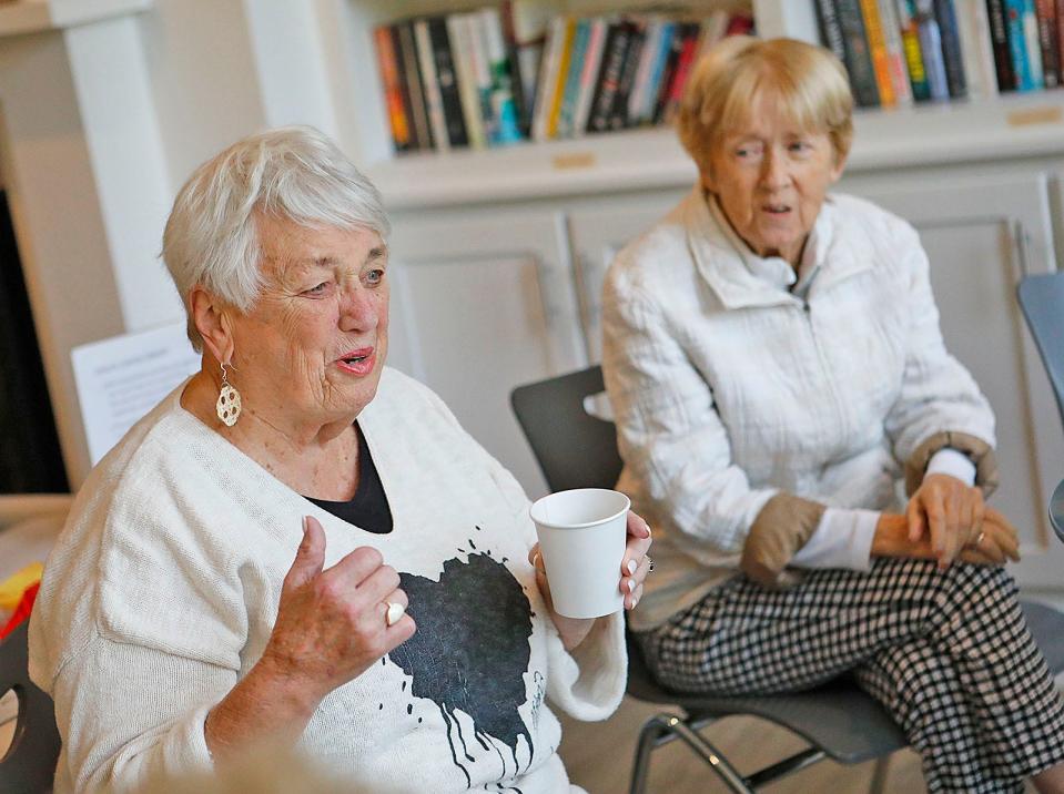 Barbara Kane and Millie Kerrigan, both 83, talk with friends over coffee on Wednesday, Sept. 27, 2023, after a yoga class at the Scituate Senior Center.