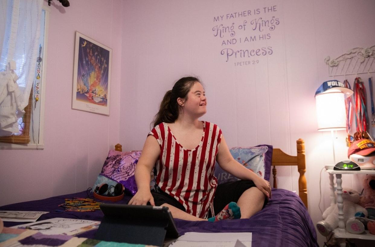 Anna Lopez laughs in her bedroom while joking with her parents, Jan and Juan Lopez, at their home in Pharr. The Lopez family didn't know Anna, who is on the autism spectrum, would be losing services like in-home care when they decided to move from Minnesota to Texas.
(Photo: Sara Diggins/AMERICAN-STATESMAN)