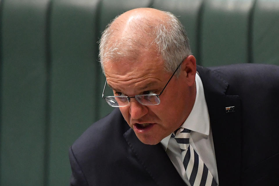 CANBERRA, AUSTRALIA - MARCH 25: Prime Minister Scott Morrison during Question Time in the House of Representatives at Parliament House on March 25, 2021 in Canberra, Australia. The federal government was on Monday set back by new allegations broadcast by the Ten Network after pixelated images of unnamed Coalition advisers allegedly engaging in performing lewd sex acts on the desks of female MPs resulting in a Morrison staff member being sacked last night. Additionally, the ABC Network aired a first hand account by an Australian Parliament security guard of what she witnessed on the night Brittany Higgins was allegedly raped in the office of then-defence industry minister Linda Reynolds in early 2019. (Photo by Sam Mooy/Getty Images)