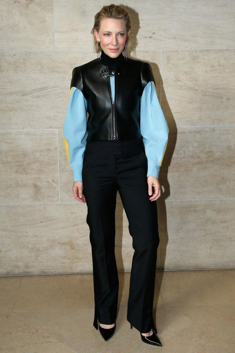 <p><strong>3 October</strong> Cate Blanchett opted for a black, blue and yellow leather jacket with trousers for the show. </p>