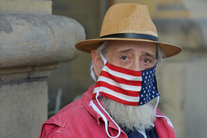 A local man wears a protective face mask with an American flag.
An open-air exhibition &#39;Polish Americans / American Poles&#39; opened in Krakow&#39;s Planty Park, organized in cooperation with the Villa Decius Cultural Institute and the US Consulate in Krakow. Throughout October, while walking along the path from Poselska Street to Wawel, visitors and passersby can learn about the stories of famous Americans of Polish origin and their descendants.
On Thursday, October 21, 2020, in Krakow, Lesser Poland Voivodeship, Poland. (Photo by Artur Widak/NurPhoto via Getty Images)