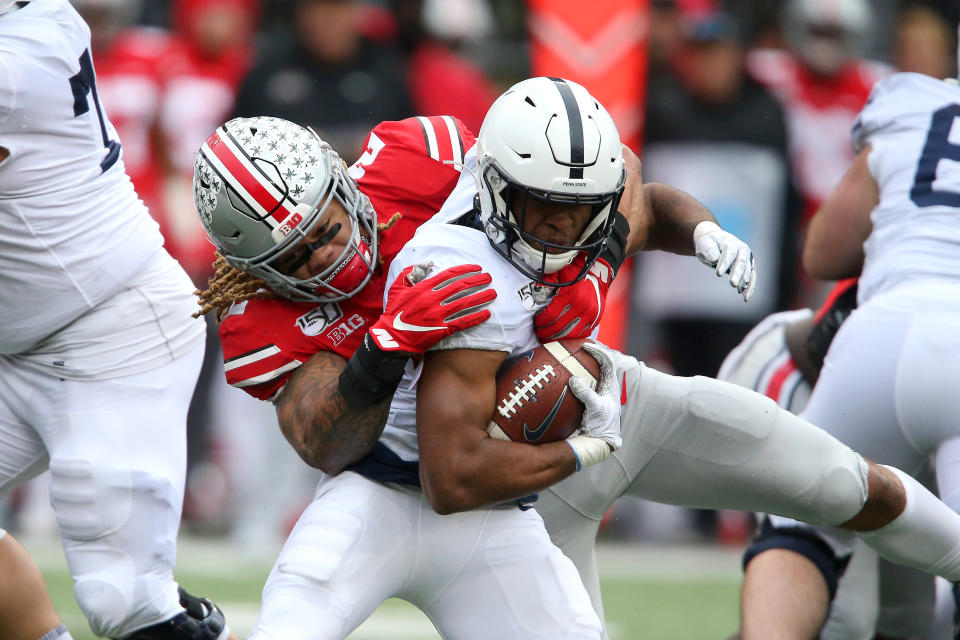 Penn State running back Journey Brown (4) tackled by Ohio State defensive end Chase Young (2) during the third quarter at Ohio Stadium. (USA Today)