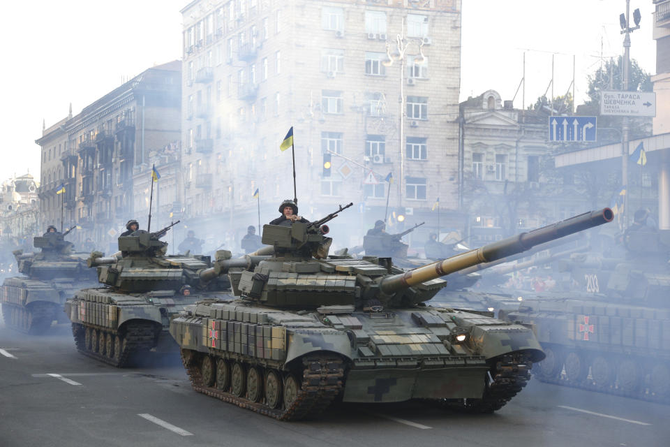 Tanks ride along Khreshchatyk Street, during a rehearsal for the Independence Day military parade in Kiev, Ukraine, Wednesday, Aug. 22, 2018. Ukraine will mark the 27th anniversary of the Independence Day on Aug. 24. (AP Photo/Efrem Lukatsky)