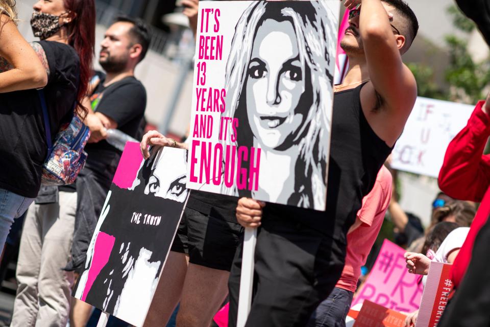 Fans of Britney Spears protest in front of the Stanley Mosk Courthouse during Britney's hearing to end her father's controversial guardianship, in Los Angeles, California on September 29, 2021. - Britney Spears' bid to end her father's controversial guardianship could reach its conclusion in a new court hearing in Los Angeles on Wednesday, after weeks of twists and turns -- and two major new documentaries about the pop star.
The courtroom was at full capacity, with some fans arriving before dawn to try to get one of the small number of available public seats. (Photo by VALERIE MACON / AFP) (Photo by VALERIE MACON/AFP via Getty Images)