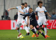 Soccer Football - Ligue 1 - Olympique de Marseille vs Bordeaux - Orange Velodrome, Marseille, France - February 18, 2018 Bordeaux's Martin Braithwaite in action with Marseille's Lucas Ocampos REUTERS/Jean-Paul Pelissier