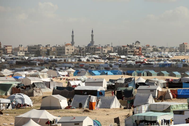 A tent camp shelters refugees who have fled fighting between Israeli and Palestinian forces in Rafah in the southern Gaza Strip on February 1. Photo by Ismael Mohamad/UPI