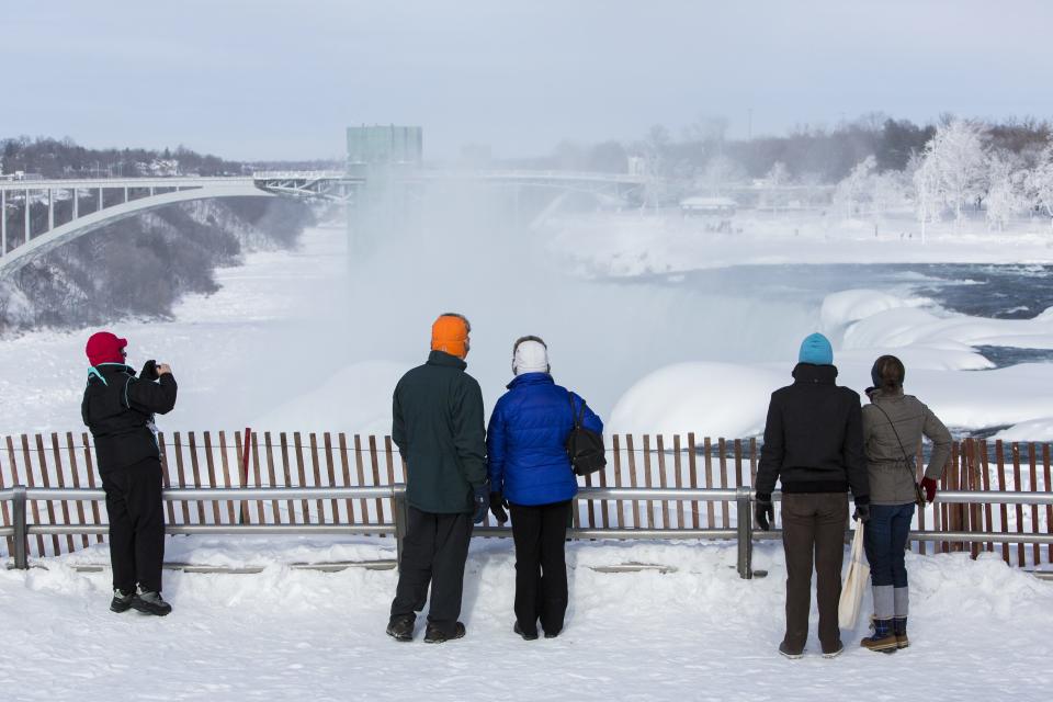 Visitors view frozen Niagara Falls in Niagara Falls New York