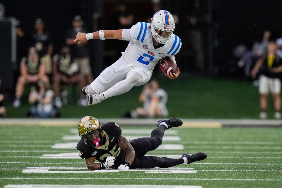 Sep 14, 2024; Winston-Salem, North Carolina, USA; Wake Forest Demon Deacons defensive back Jamare Glasker (25) upends Mississippi Rebels quarterback Jaxson Dart (2) during the first half at Allegacy Federal Credit Union Stadium. Mandatory Credit: Jim Dedmon-Imagn Images