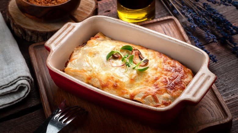 Cheesy lasagna in baking dish