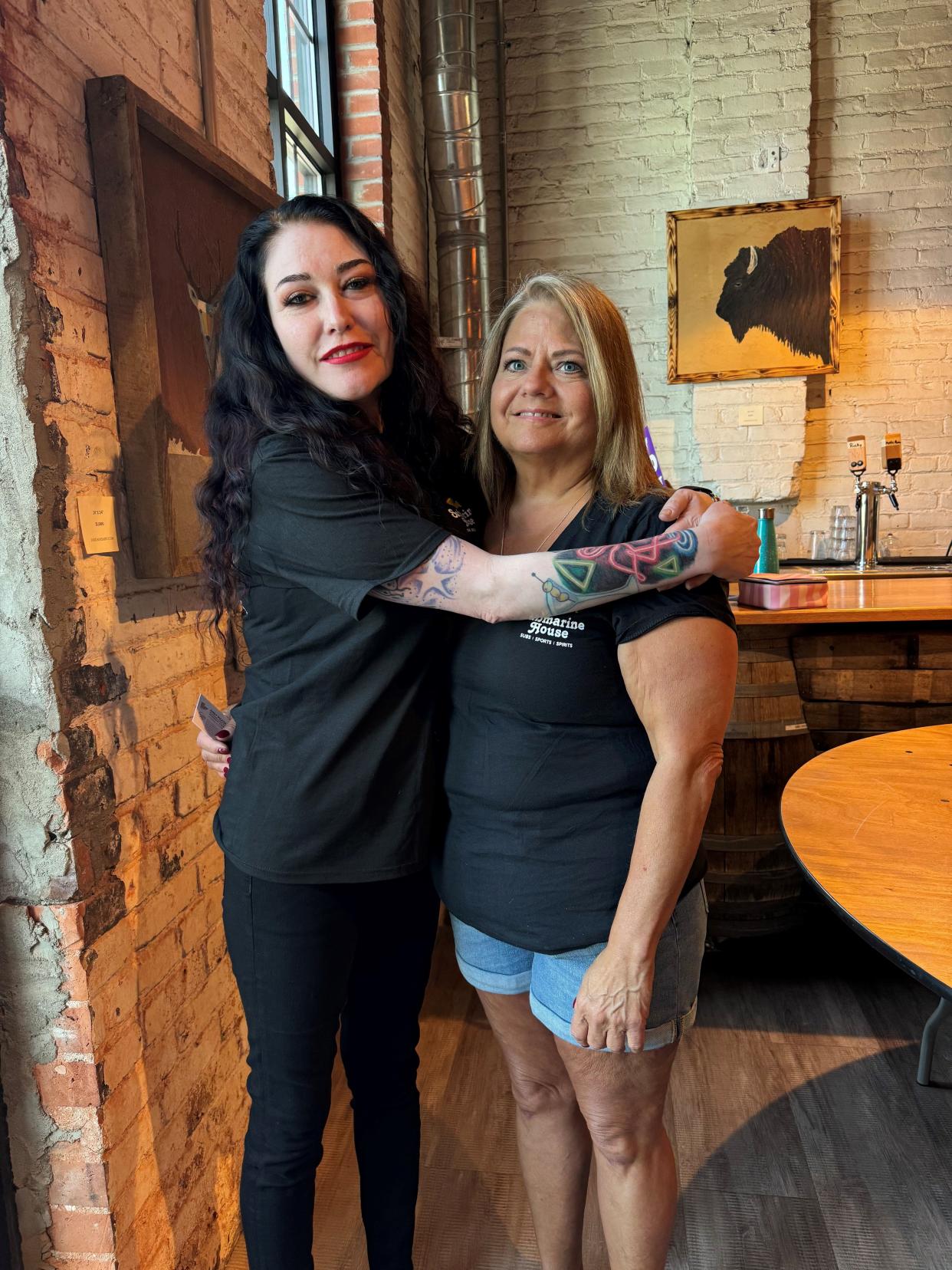 Lindsay O'Dell, left, works as a bartender at Submarine House, which is owned by Robin McGrath. They oppose a proposed ballot issue to raise the state minimum wage to $15 an hour for all workers and eliminate the current system that pays tipped workers a lower wage.