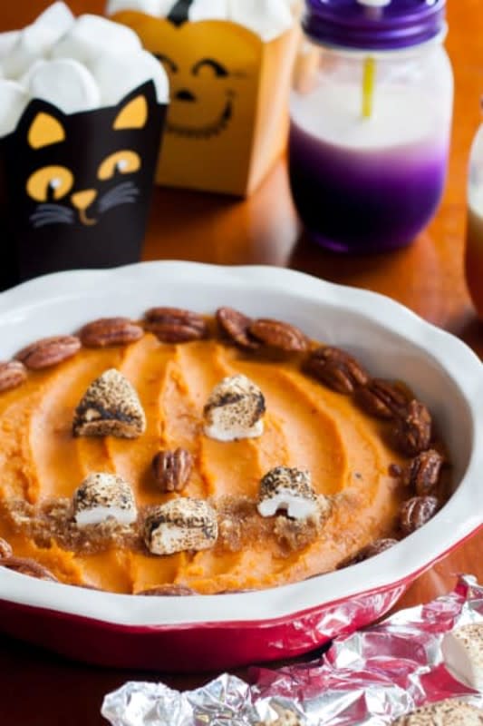 <p>Southern Halloween Queen</p><p>Perfect for a Halloween dinner party! This sweet potato jack-o’-lantern is so fun! Who says you shouldn’t play with your food?</p><p><strong>Get the recipe: <a href="https://www.southernhalloweenqueen.com/sweet-potato-jack-o-lantern/" rel="nofollow noopener" target="_blank" data-ylk="slk:Sweet Potato Jack-O'-Lanterns;elm:context_link;itc:0;sec:content-canvas" class="link ">Sweet Potato Jack-O'-Lanterns</a></strong></p>