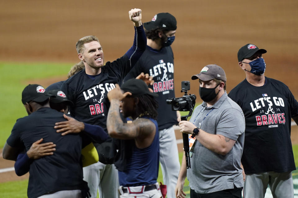 Atlanta Braves' Freddie Freeman gestures as they celebrate after defeating the Miami Marlins in Game 3 of a baseball National League Division Series, Thursday, Oct. 8, 2020, in Houston. (AP Photo/David J. Phillip)