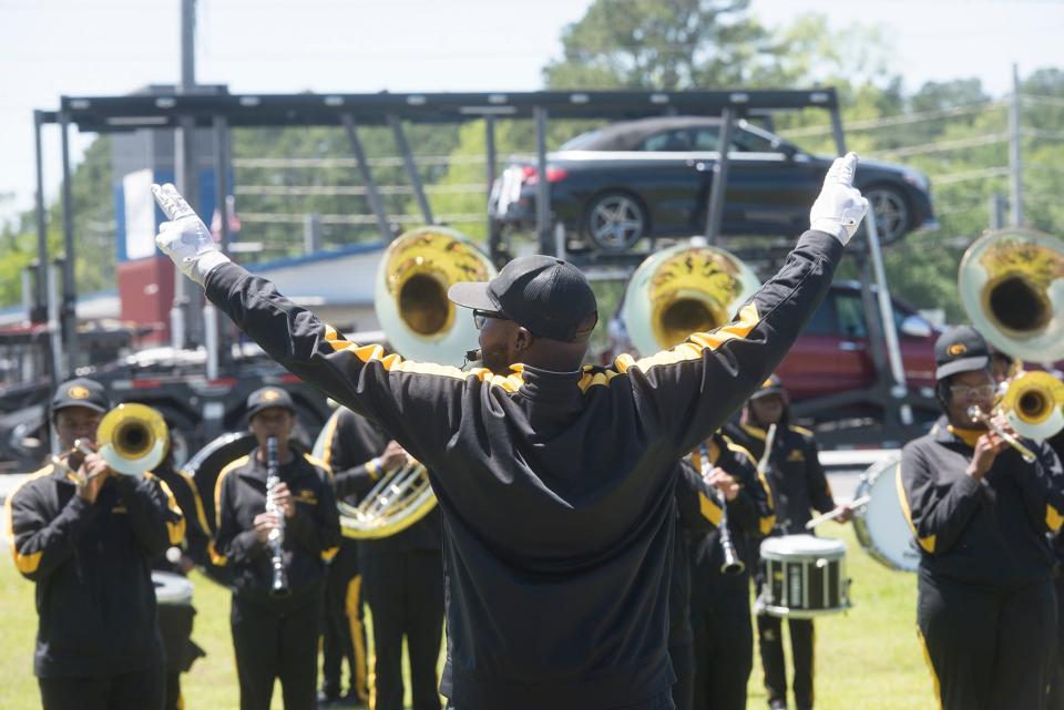 Groves High School's Marching Band performs outside Port Wentworth City Hall on Tuesday during an announcement for the Savannah Ghost Pirates training facility, to be located in the city's upcoming recreation complex.