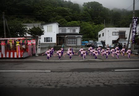 Women perform traditional dance during the matsuri (folk festival) in Rausu