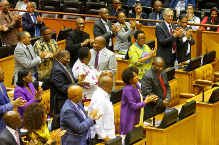 Cyril Ramaphosa is applauded by MPs after being elected President of South Africa in Parliament in Cape Town, South Africa, February 15, 2018. REUTERS/Mike Hutchings