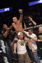 Renan Barao celebrates with his team after his victory over Urijah Faber after their UFC interim bantamweight championship bout at UFC 149 inside the Scotiabank Saddledome on July 21, 2012 in Calgary, Alberta, Canada. (Photo by Nick Laham/Zuffa LLC/Zuffa LLC via Getty Images)