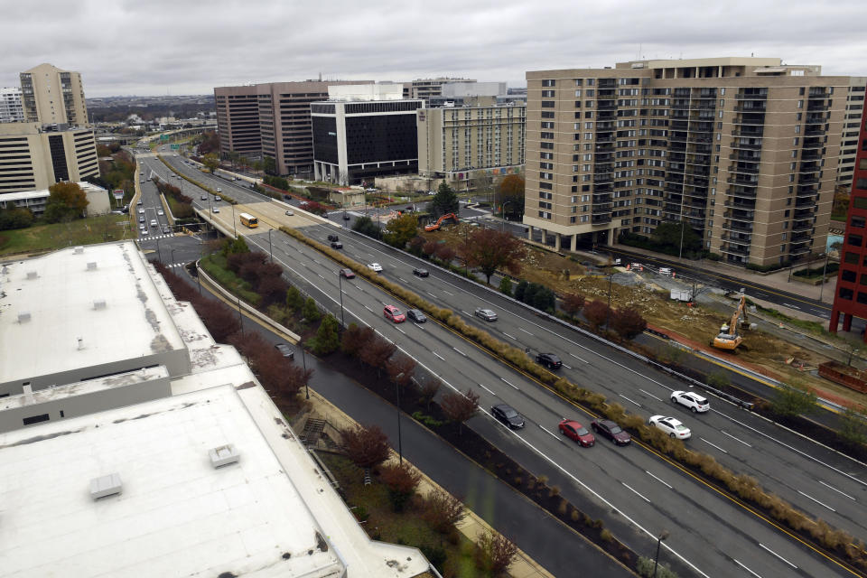 FILE- This Tuesday, Nov. 13, 2018, file photo shows a view of Crystal City, Va. On Tuesday, Nov. 13, Amazon said it will split its second headquarters between Long Island City in New York and Crystal City. Development along major highways in Northern Virginia and Washington have led to “unreasonable traffic delays on a daily basis” in the past few years, with drive times that used to take 40 minutes ballooning to up to 90 minutes, said Thomas Cooke, professor of business law at Georgetown University's McDonough School of Business. (AP Photo/Susan Walsh, File)