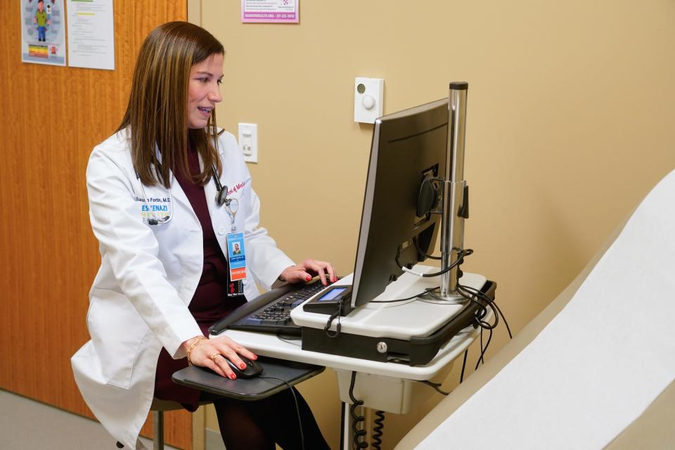 Saura Fortin Erazo, M.D. sees a patient in Primary Care on Tuesday, Dec. 12, 2023, at Sidney & Lois Eskenazi Hospital in downtown Indianapolis. As an Eskenazi Health provider, Fortin Erazo also staffs the urgent care clinic.