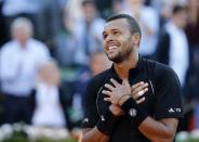 Jo-Wilfried Tsonga of France celebrates after defeating Kei Nishikori of Japan during their men's quarter-final match during the French Open tennis tournament at the Roland Garros stadium in Paris, France, June 2, 2015. REUTERS/Pascal Rossignol