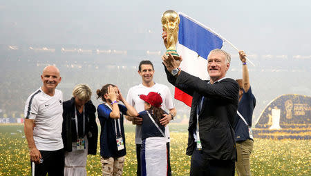 Soccer Football - World Cup - Final - France v Croatia - Luzhniki Stadium, Moscow, Russia - July 15, 2018 France coach Didier Deschamps celebrates with the trophy after winning the World Cup REUTERS/Carl Recine