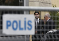 Security guards stand outside Saudi Arabia's consulate in Istanbul, Friday, Oct. 19, 2018. A Turkish official said Friday that investigators are looking into the possibility that the remains of missing Saudi journalist Jamal Khashoggi may have been taken to a forest in the outskirts of Istanbul or to another city — if and after he was killed inside the consulate earlier this month. (AP Photo/Lefteris Pitarakis)