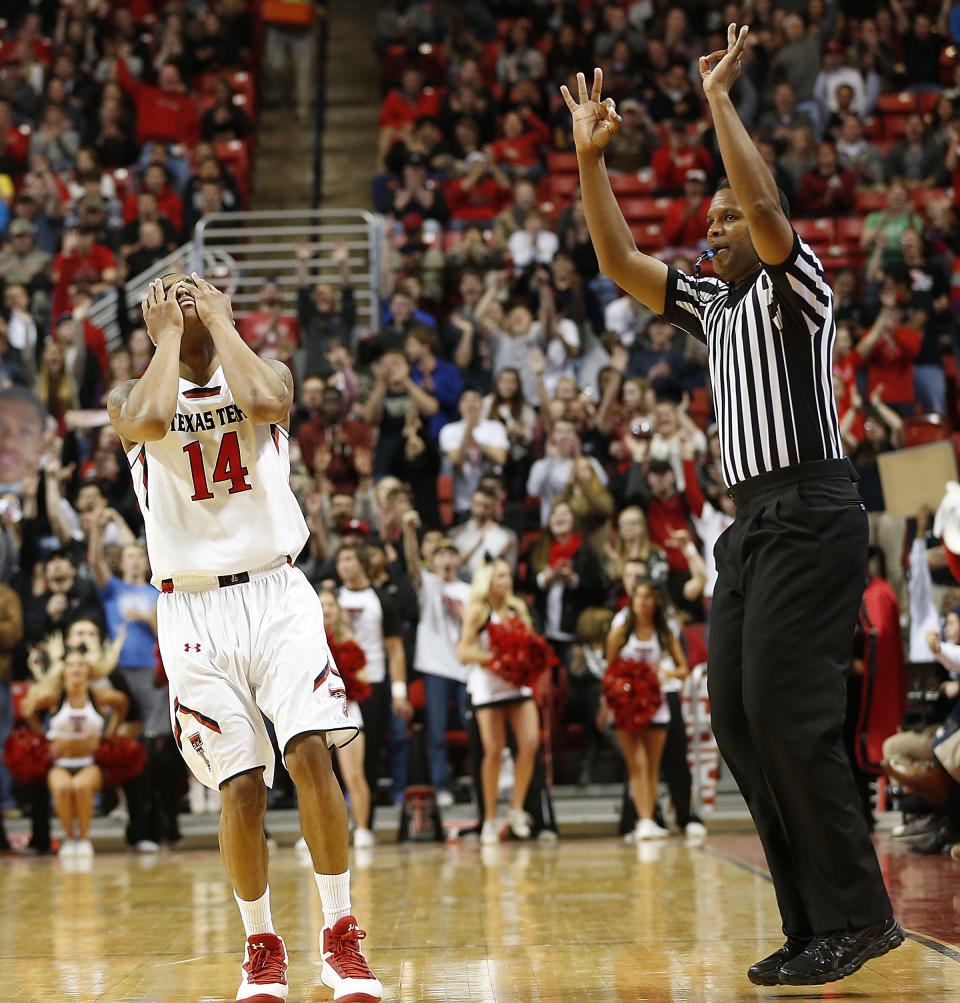 Texas Tech's Robert Turner (14) celebrates hitting a 3-point basket against Baylor during an NCAA college basketball game in Lubbock, Texas, Wednesday, Jan, 15, 2014. (AP Photo/Lubbock Avalanche-Journal, Tori Eichberger) ALL LOCAL TV OUT