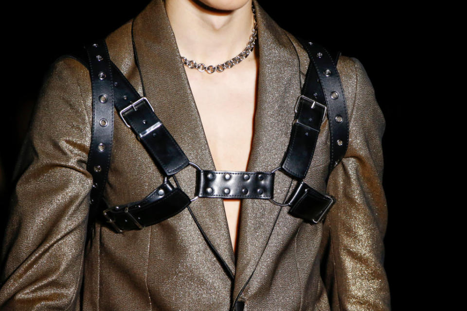 Jeremy Scott pairs leather harnesses with destroyed boardroom apparel. (Photo: Getty Images)