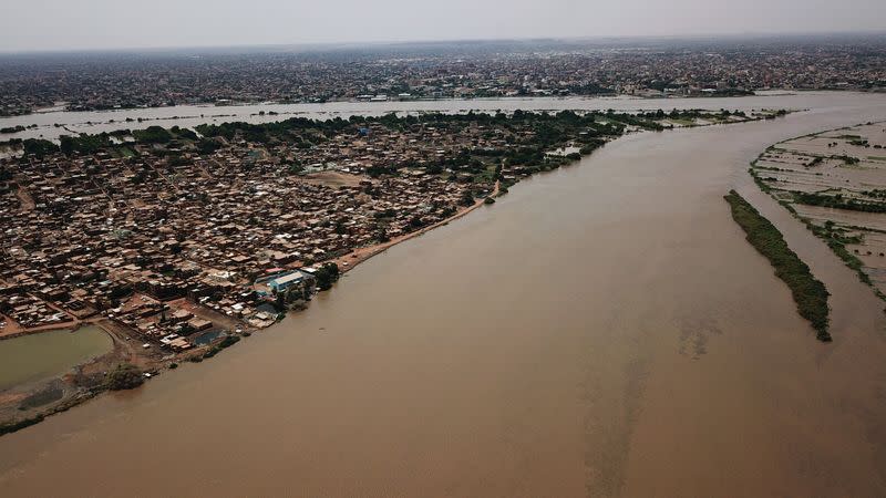 An aerial view shows buildings and roads submerged by floodwaters near the Nile River in South Khartoum